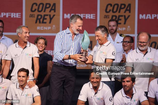 King Felipe VI presents the MAPFRE King's Cup sailing trophies to Javier Banderas and his crew on August 6th, 2022 in Mallorca, Spain.