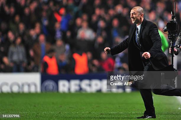 Chelsea's coach Roberto Di Matteo celebrates at the end of the UEFA Champions League round of 16 second leg football match Chelsea vs Napoli at...