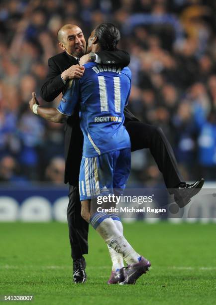 Roberto Di Matteo caretaker manager of Chelsea celebrates victory with Didier Drogba after the UEFA Champions League Round of 16 second leg match...