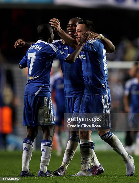 Ramires, Didier Drogba and John Terry of Chelsea celebrate their team's victory after the final whistle during the UEFA Champions League round of 16...