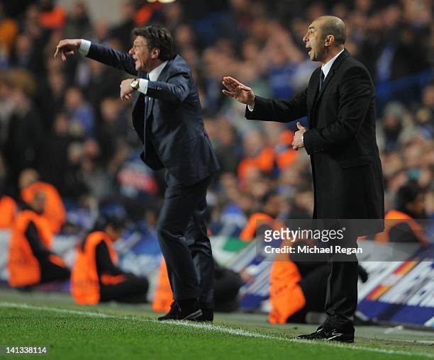Walter Mazzarri coach of Napoli and Roberto Di Matteo caretaker manager of Chelsea signal from the touchline during the UEFA Champions League Round...
