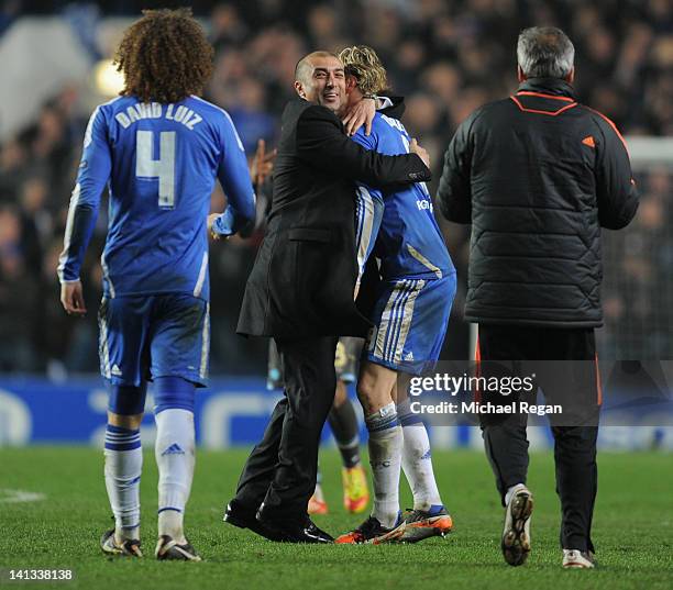 Roberto Di Matteo caretaker manager of Chelsea celebrates victory with Fernando Torres after the UEFA Champions League Round of 16 second leg match...