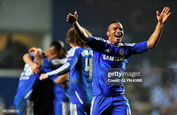 Chelsea's French midfielder Florent Malouda celebrates after winning their UEFA Champions League round of 16 second leg football match against Napoli...