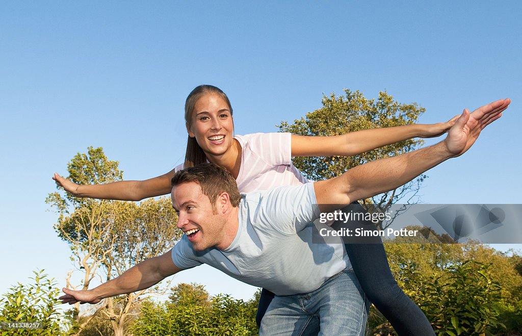 Couple playing together in park