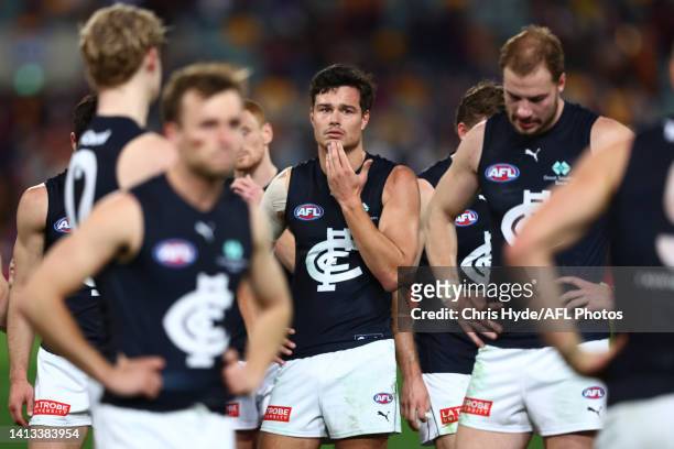 Blues leave the field after losing during the round 21 AFL match between the Brisbane Lions and the Carlton Blues at The Gabba on August 07, 2022 in...