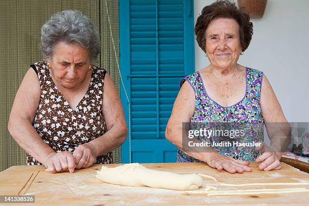 older women making pasta together - italian culture bildbanksfoton och bilder