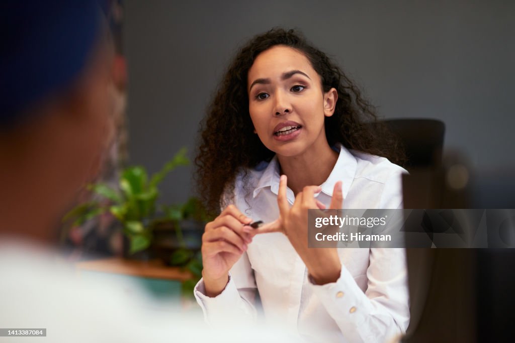 Angry, serious and frustrated manager, boss or leader firing an employee and counting strikes during a performance review meeting. Female CEO explaining job loss and the financial crisis to staff