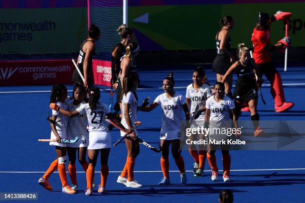 Salima Tete of Team India celebrates with team mates after scoring their sides first goal during the Women's Hockey - Bronze Medal match between New...