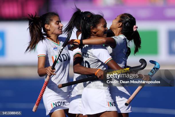 Salima Tete of Team India celebrates with team mates after scoring their sides first goal during the Women's Hockey - Bronze Medal match between New...