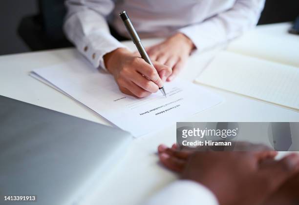 signing a contract or agreement for an investment at a business meeting. closeup of hands filling in a form or legal document for a financial partnership inside an office by a sales employee - legal contract stock pictures, royalty-free photos & images