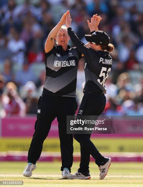 Sophie Devine of Team New Zealand celebrates with team mates after bowling Natalie Sciver of Team England during the Cricket T20 - Bronze Medal match...