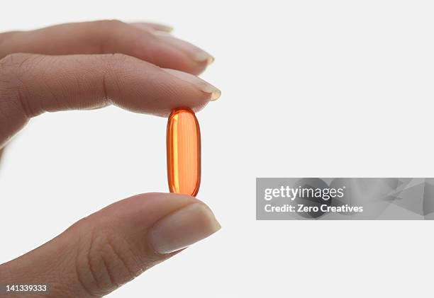 close up of woman holding pill - tablet hands stock pictures, royalty-free photos & images