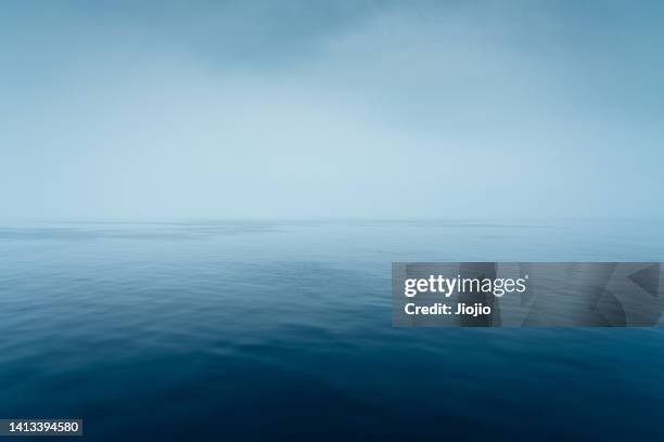 seascape in the rain - overcast ocean stock pictures, royalty-free photos & images