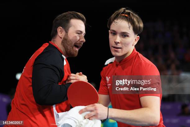 Joshua Stacey of Team Wales talks with his coach during their Para Table Tennis Men's Singles Classes 8-10 Gold Medal match against Lin Ma of Team...
