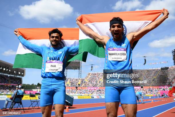 Gold medalist Eldhose Paul of Team India and silver medalist Abdulla Aboobacker of Team India celebrate following the Men's Triple Jump Final on day...