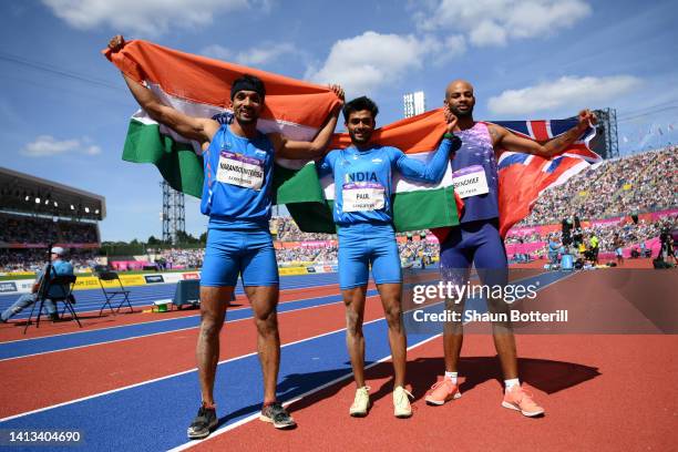 Silver medalist Abdulla Aboobacker of Team India, gold medalist Eldhose Paul of Team India and bronze medalist Jah-Nhai Perinchief of Team Bermuda...