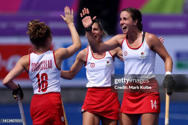 Karli Johansen of Team Canada celebrates with team mates after scoring their sides third goal during the Women's Hockey - Classification 5-6 match...