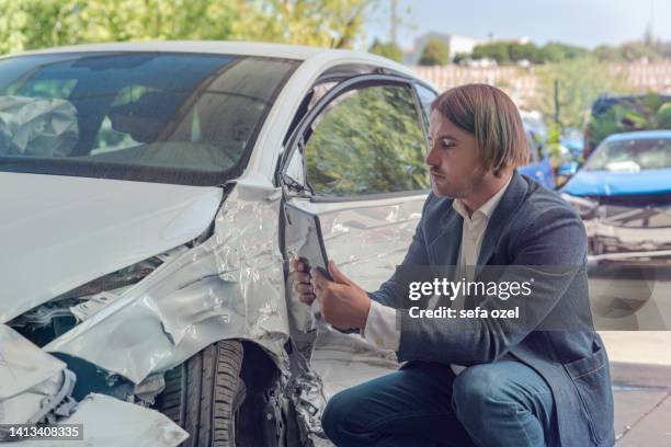 taking a photo of the car after a traffic accident - car accident photo stock pictures, royalty-free photos & images