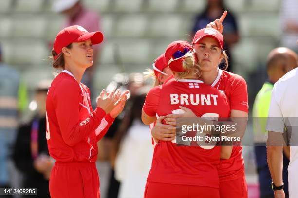 Nat Sciver and Katherine Brunt of Team England embrace following the Cricket T20 - Bronze Medal match between Team England and Team New Zealand on...