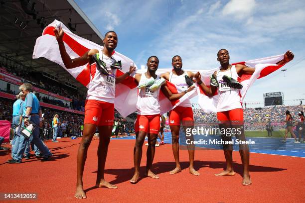 Zharnel Hughes, Jona Efoloko, Nethaneel Mitchell-Blake and Ojie Edoburun of Team England celebrate winning the gold medal in the Men's 4 x 100m Relay...