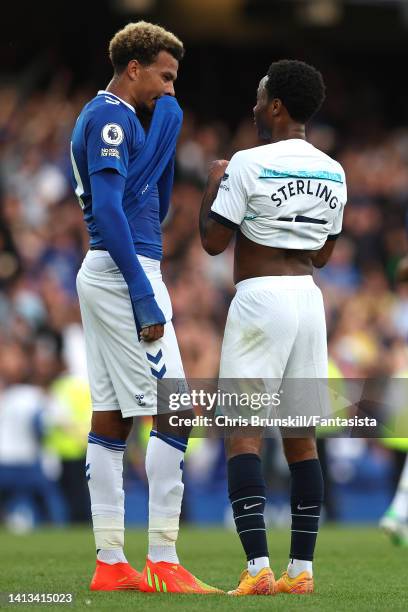 Dele Alli of Everton chats with Raheem Sterling of Chelsea at full-time following the Premier League match between Everton FC and Chelsea FC at...