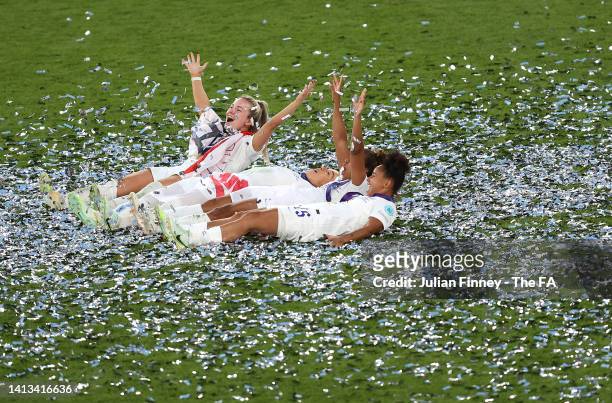 Lauren Hemp, Lucy Bronze, Demi Stokes and Nikita Parris of England celebrate following the UEFA Women's Euro 2022 final match between England and...