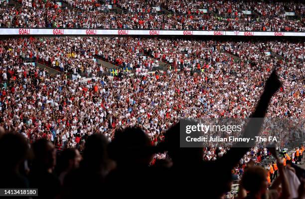 Fans celebrate England's victory following the UEFA Women's Euro 2022 final match between England and Germany at Wembley Stadium on July 31, 2022 in...