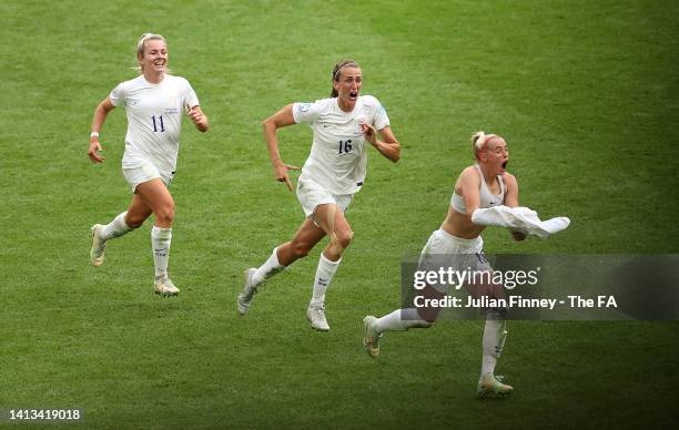 Chloe Kelly of England celebrates with teammates Jill Scott and Lauren Hemp after scoring their team's second goal during the UEFA Women's Euro 2022...