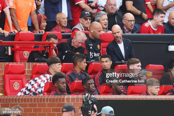 Raphael Varane and Cristiano Ronaldo of Manchester United look on from the substitutes bench during the Premier League match between Manchester...