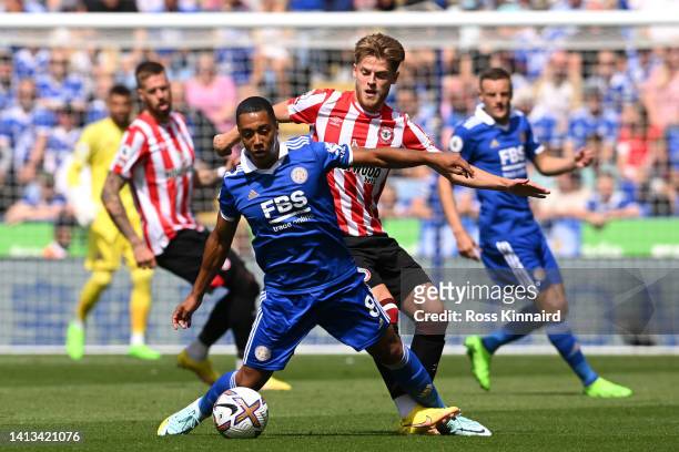 Youri Tielemans of Leicester City and Mathias Jensen of Brentford battle for the ball during the Premier League match between Leicester City and...