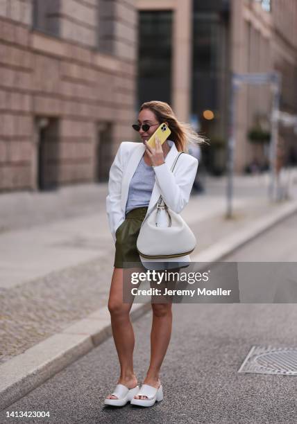 Sonia Lyson wearing Zara platform white sandals, Gucci Attache beige leather shoulder bag, Zara white statement blazer, Saint Laurent black shades,...