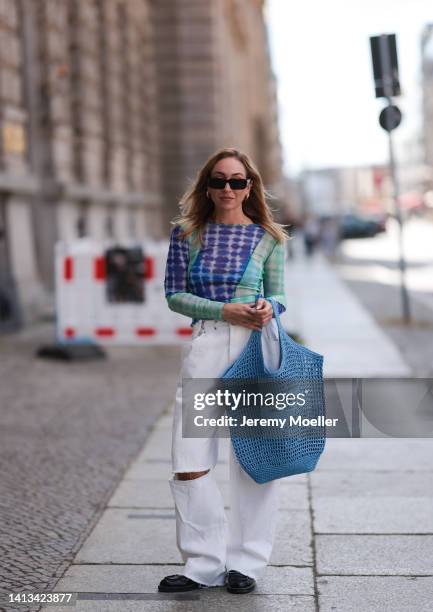Sonia Lyson wearing Prada blue bast tote bag, Prada shades, Zara mashed transparent blue top, Storets white destroyed denim jeans, Prada black...