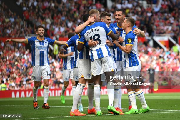 Pascal Gross of Brighton & Hove Albion celebrates with teammates after scoring their team's first goal during the Premier League match between...