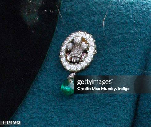 Camilla, Duchess of Cornwall wears a brooch previously worn by Princess Diana as she attends day 2 'Ladies Day' of the Cheltenham Horse Racing...