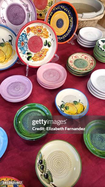 decorative ceramic plates on street market - shoreditch stock pictures, royalty-free photos & images