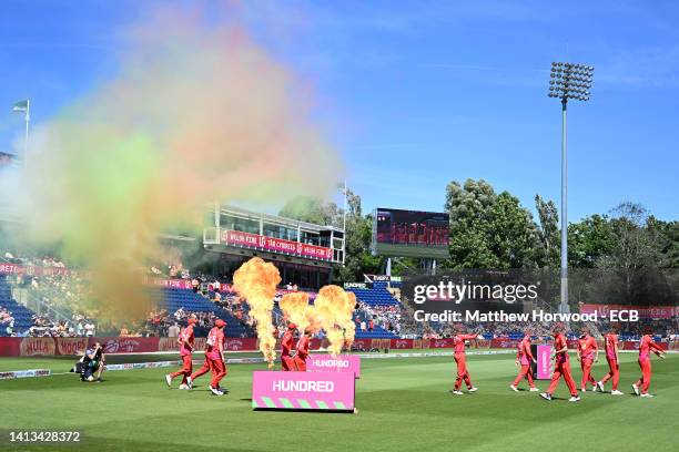 Welsh Fire players walk out during The Hundred match between Welsh Fire Men and Oval Invincibles Men at Sophia Gardens on August 07, 2022 in Cardiff,...