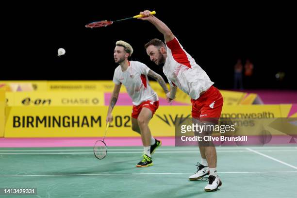 Sean Vendy and Ben Lane of Team England compete during Badminton Men's Doubles - Semi-Final match between Malaysia and England on day ten of the...
