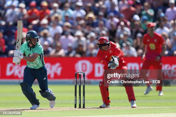 Sam Curran of Oval Invincibles bats as Joe Clarke of Welsh Fire keeps wicket during The Hundred match between Welsh Fire Men and Oval Invincibles Men...