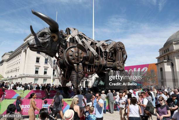 Members of the public crowd around the giant mechanical bull on day ten of the Birmingham 2022 Commonwealth Games in Birmingham's Centenary Square on...