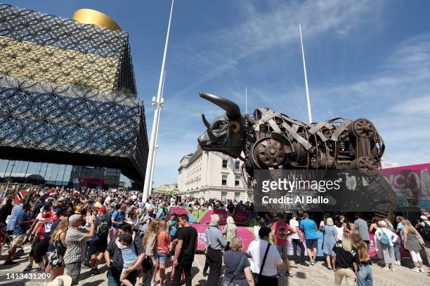 Members of the public crowd around the giant mechanical bull on day ten of the Birmingham 2022 Commonwealth Games in Birmingham's Centenary Square on...