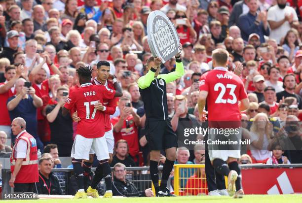 Cristiano Ronaldo of Manchester United is substituted on for Fred during the Premier League match between Manchester United and Brighton & Hove...