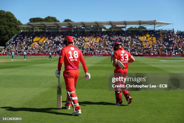 Welsh Fire openers, Tom Banton and Joe Clarke walk out to bat during The Hundred match between Welsh Fire Men and Oval Invincibles Men at Sophia...