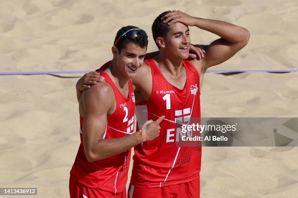 Joaquin Bello and Javier Bello of Team England celebrate after defeating Team Rwanda during the Men's Beach Volleyball Bronze Medal match on day ten...