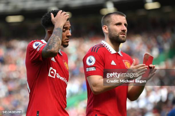 Jadon Sancho and Luke Shaw of Manchester United react after the Premier League match between Manchester United and Brighton & Hove Albion at Old...