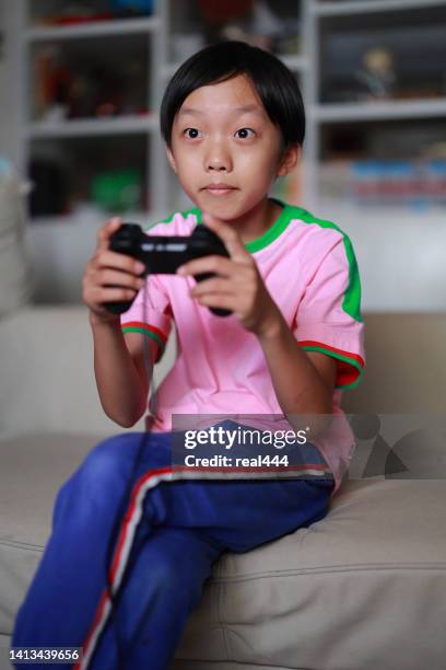 Tween Playing Video Games Photos and Premium High Res Pictures - Getty ...