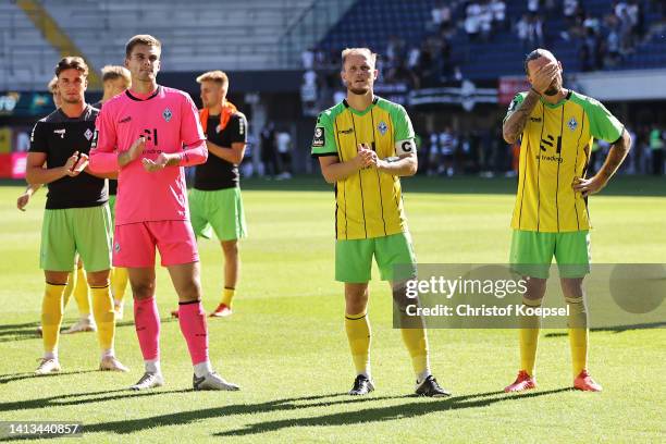 Morten Behrens, Marcel Seegert and Marco Hoeger of Waldhof Mannheim look dejected after the 2-2 draw of the 3. Liga match between SC Verl and Waldhof...