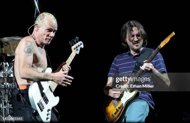 Bassist Flea and guitarist John Frusciante of Red Hot Chili Peppers perform at Allegiant Stadium on August 06, 2022 in Las Vegas, Nevada.