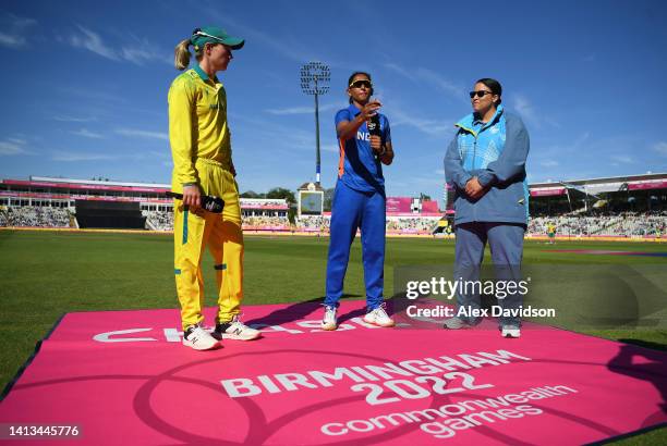 Harmanpreet Kaur of India flips the coin as Meg Lanning of Australia looks on ahead of the Cricket T20 - Gold Medal match between Team India and Team...