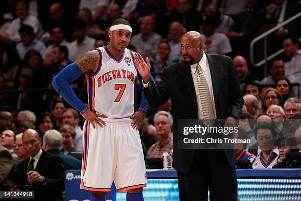 Mike Woodson the interim head coach of the New York Knicks coaches Carmelo Anthony of the New York Knicks during the game against the Portland...