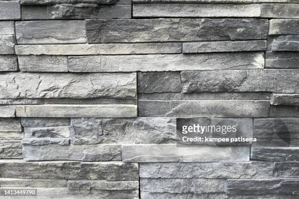 textured black granite rectangular tiles - grey brick wall stock pictures, royalty-free photos & images
